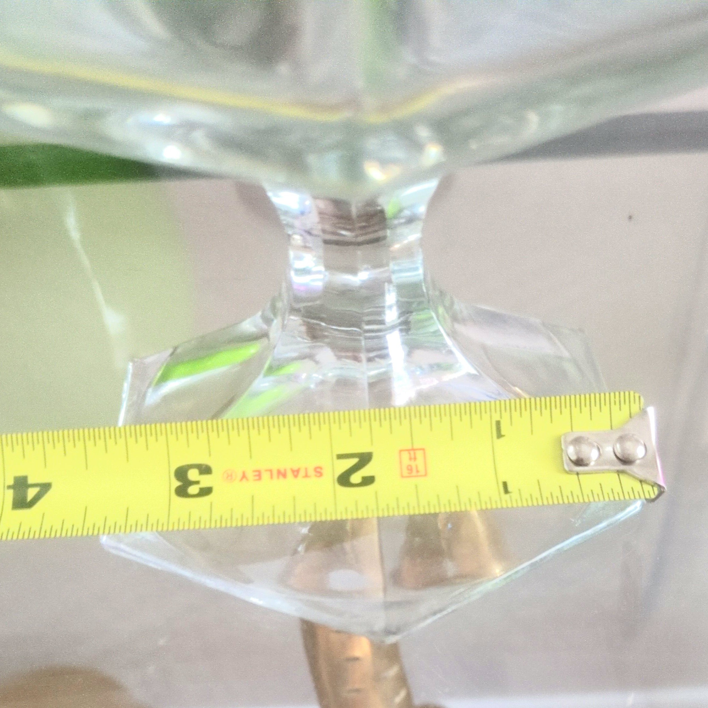 vintage clear pressed-glass octagonal pedestal compote  that glows blue under a 365 UV light.