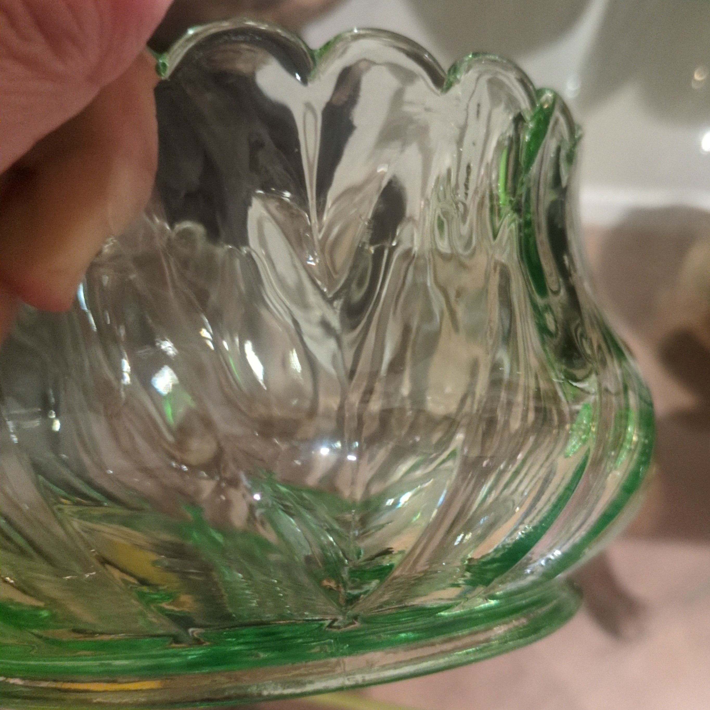 vintage emerald green pressed glass bowl with a scalloped rim.